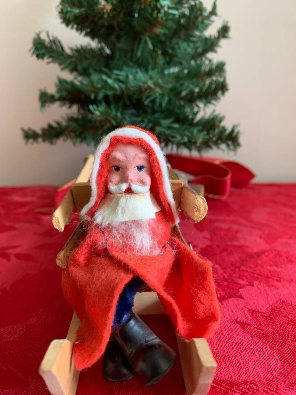 Vintage Santa Claus in rustic wooden sleigh Christmas decoration